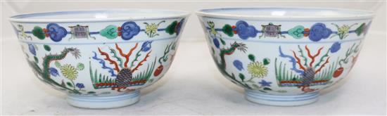 A pair of Chinese wucai dragon and phoenix bowls, Qianlong seal marks, late 19th/early 20th century, 18cm, small rim chips